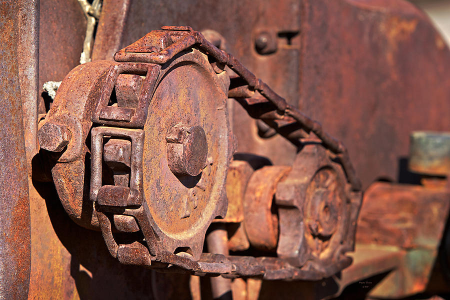 Cog And Chain In Rust Photograph by Phyllis Denton