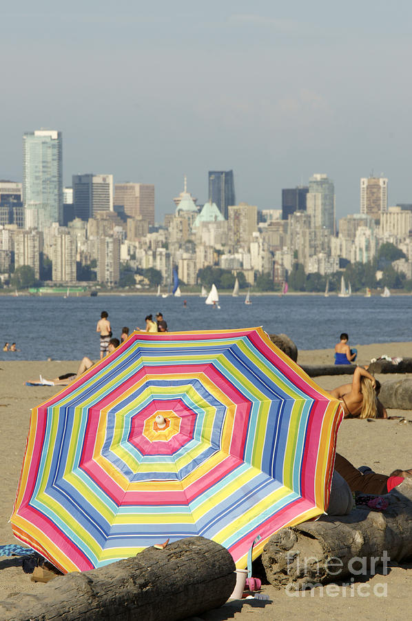 COLORFUL BEACH UMBRELLA Vancouver Canada Photograph by John  Mitchell
