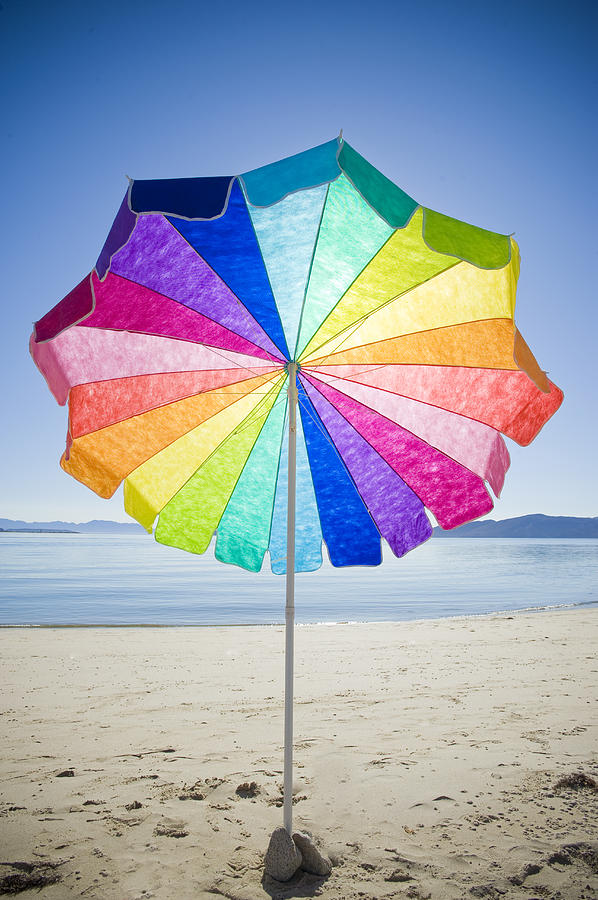 Colorful Umbrella, Sunny Day And Empty Beach Photograph by Stephen Simpson