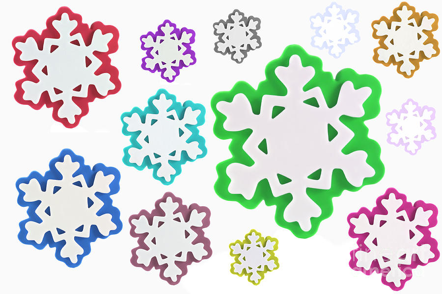 Coloured snowflakes isolated Photograph by Simon Bratt