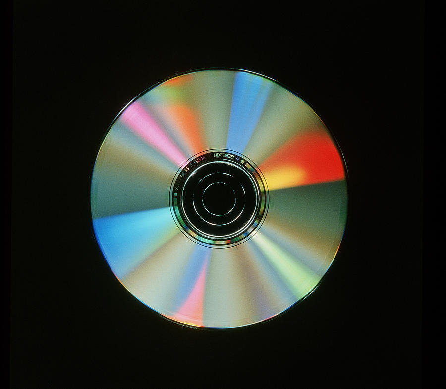 Compact Discs With Light Interference Patterns by Damien Lovegrove/science  Photo Library