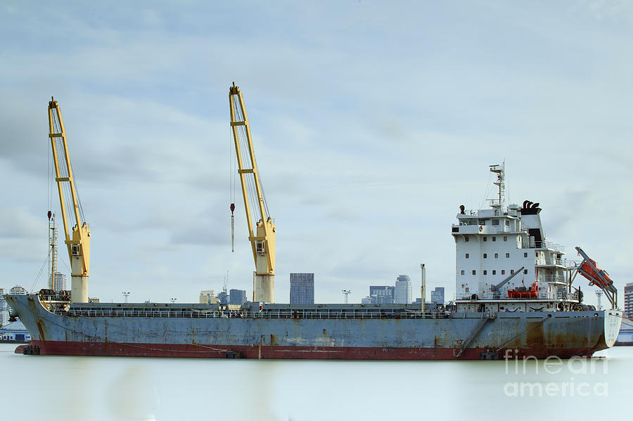 Container Cargo freight ship with working crane Photograph by Anek Suwannaphoom