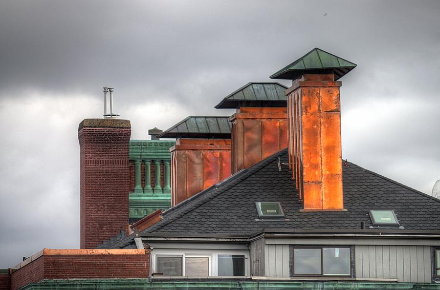 Building Photograph - Copper-lined chimneys on a grey sky by Matthew Green