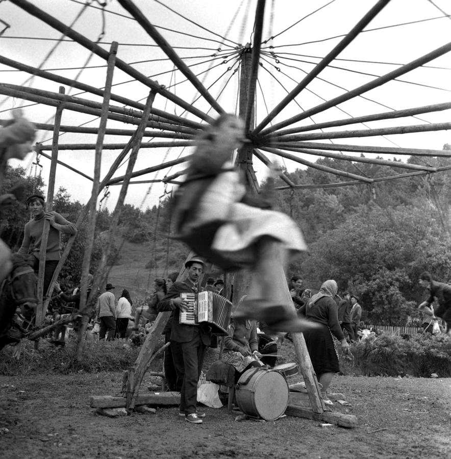 Country fair swings with accordion Photograph by Emanuel Tanjala