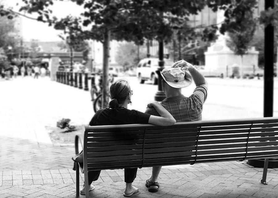 Couple Resting on Bench Downtown Photograph by Gray  Artus