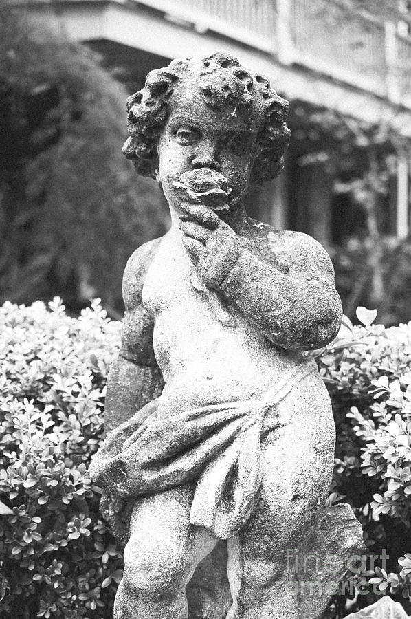 Black And White Photograph - Courtyard Statue of a Cherub French Quarter New Orleans Black and White Film Grain Digital Art by Shawn OBrien