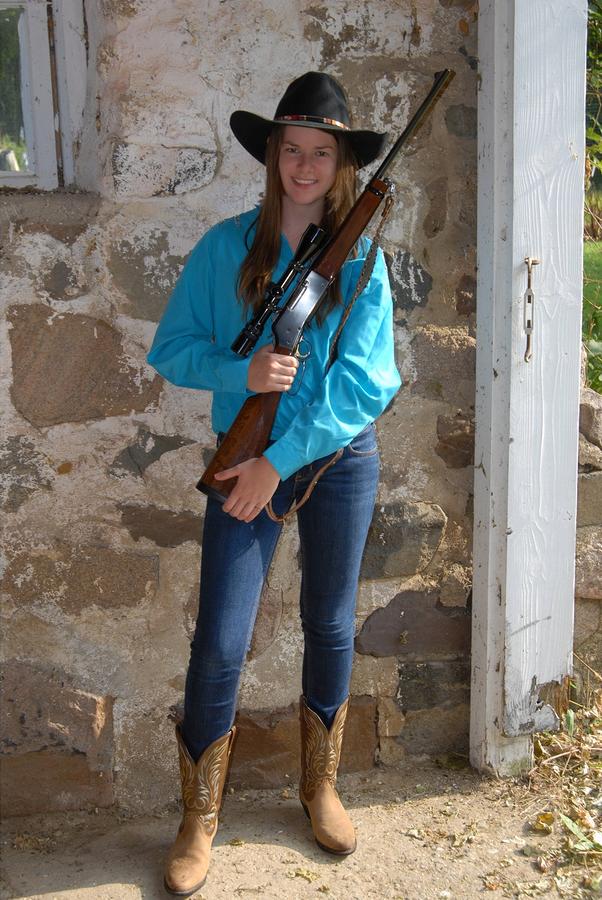 Cowgirl model with rifle Photograph by David Campione