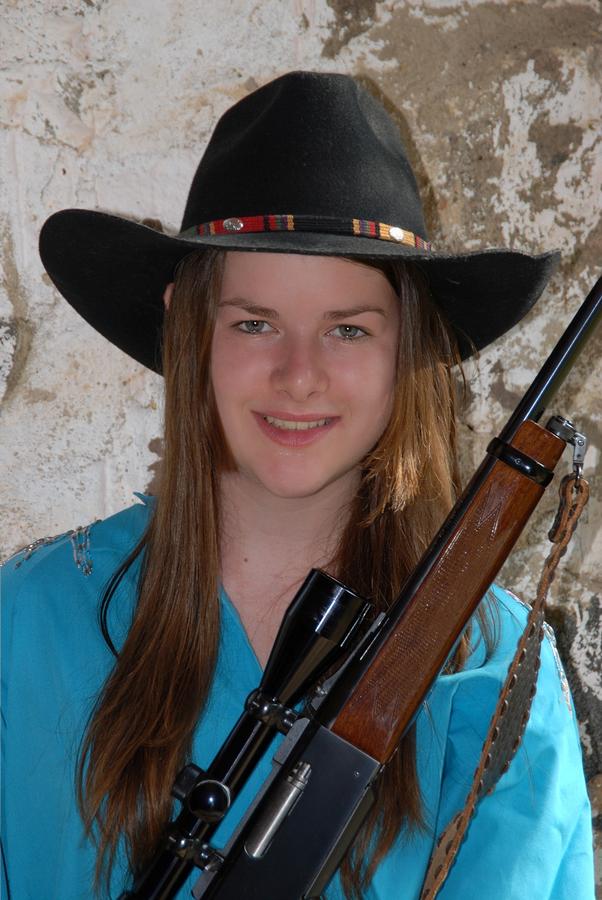 Cowgirl with rifle Photograph by David Campione