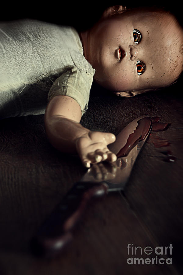 Creepy doll with bloody knife  Photograph by Sandra Cunningham