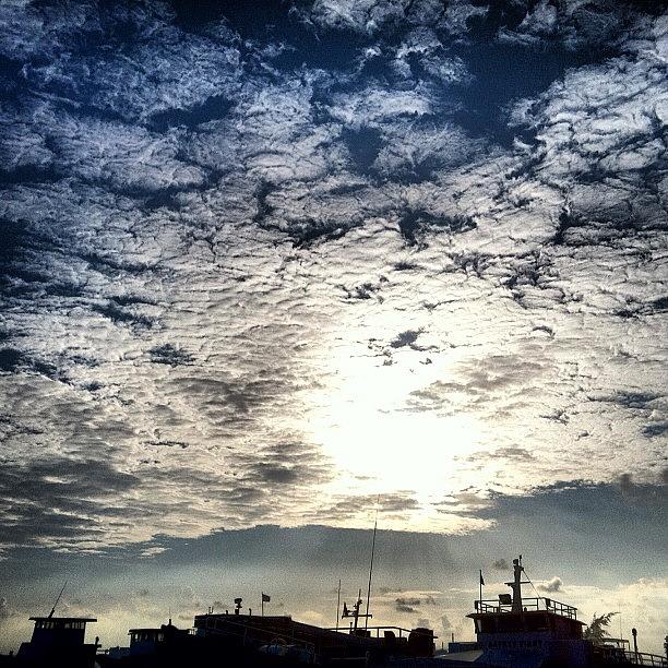 Clouds Photograph - Crispy Clouds - The Skyline Of Boats by Abid Saeed