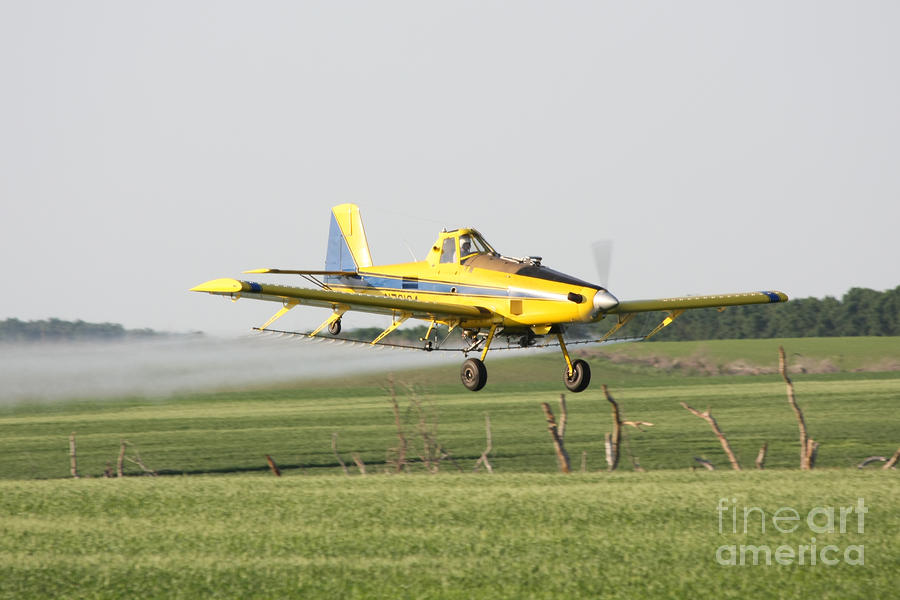 Crop Dusting Plane Going Over Crops Photograph by Lori Tordsen