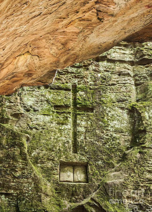 Cross engraved in a rock wall Photograph by Jeannette Hunt