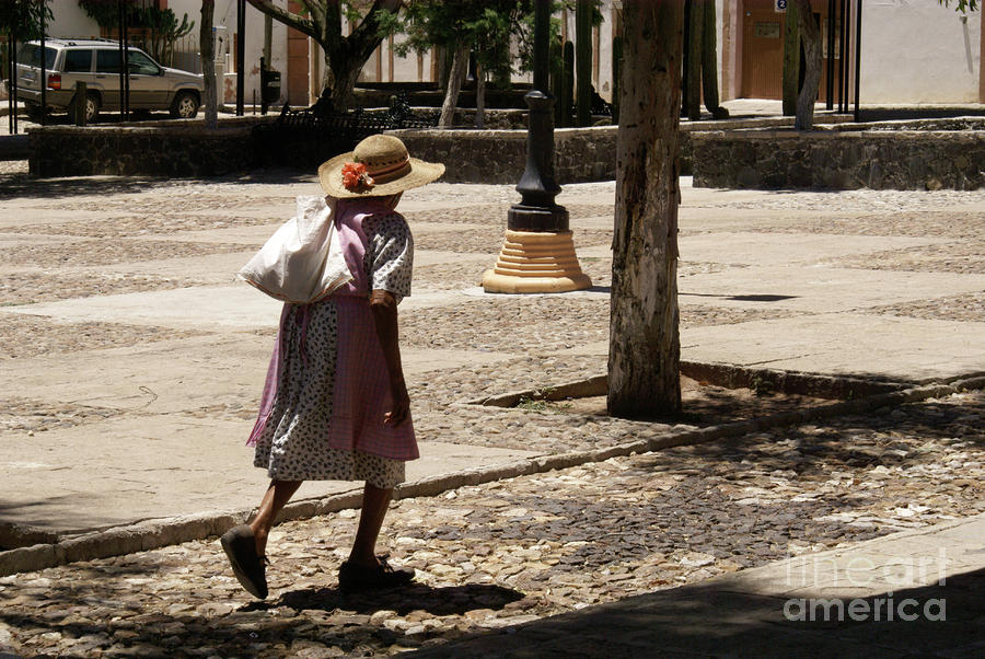 CROSSING THE PLAZA Mineral de Pozos Mexico Photograph by John  Mitchell