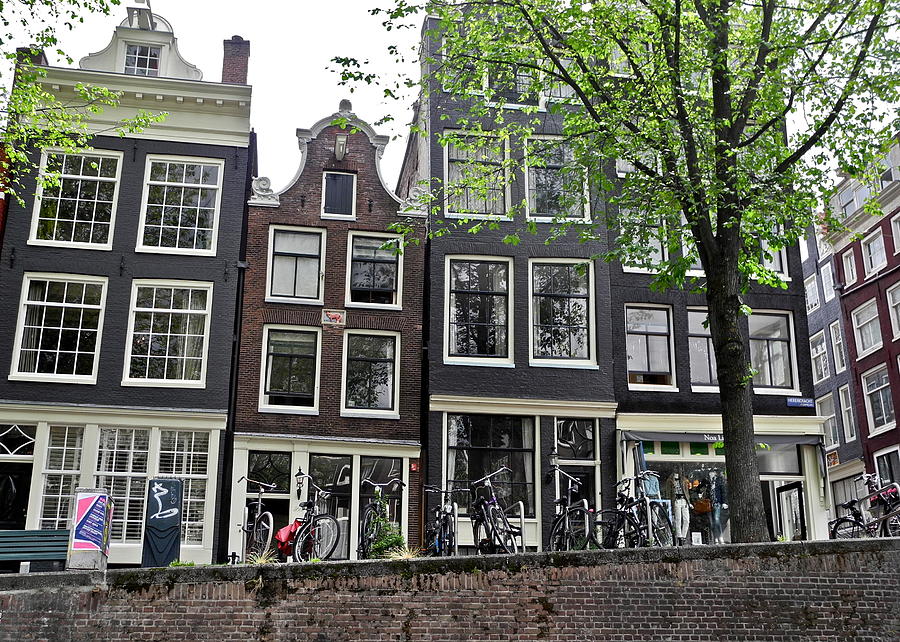 Dark Gray Brick Dwellings in Amsterdam Photograph by Kirsten Giving