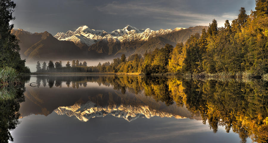 Dawn Reflection Of Lake Matheson Photograph by Colin Monteath