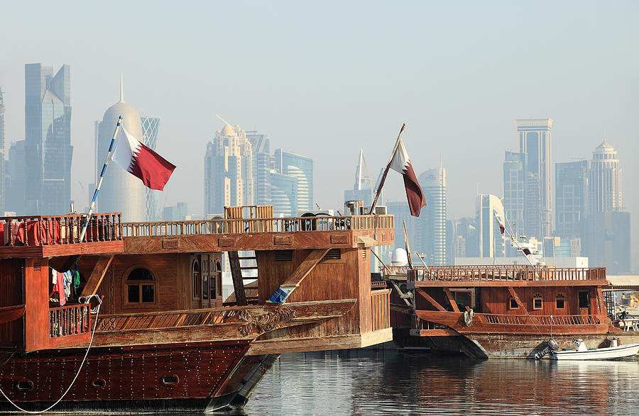 Boat Photograph - Dhows and Doha skyline by Paul Cowan