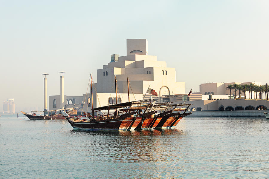 Dhows and museum Photograph by Paul Cowan