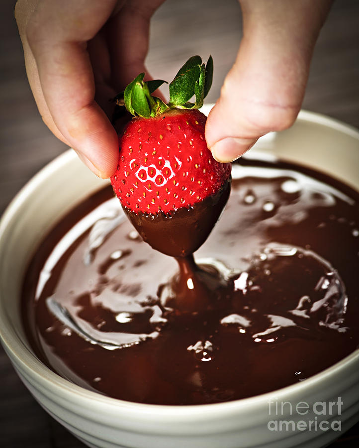 Candy Photograph - Dipping strawberry in chocolate by Elena Elisseeva