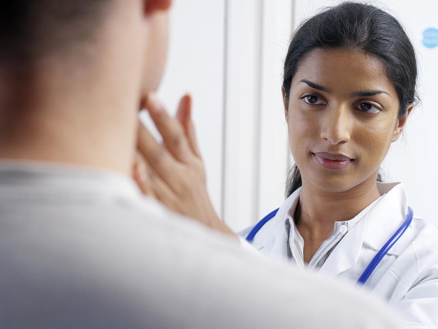 Doctor Examining A Patient by Science Photo Library