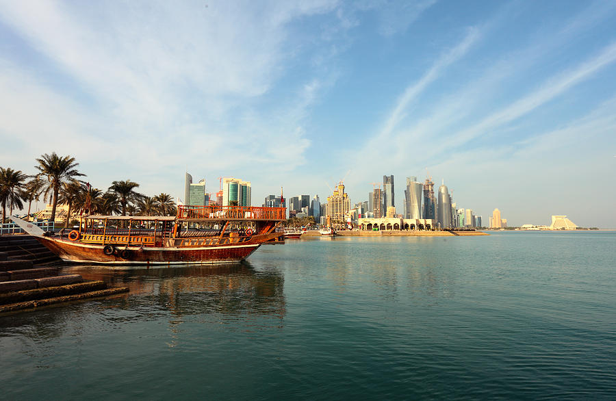 Doha dhows and skyline Photograph by Paul Cowan