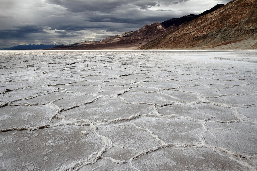 Dramatic sky at Bad water Death valley Photograph by Pierre Leclerc Photography
