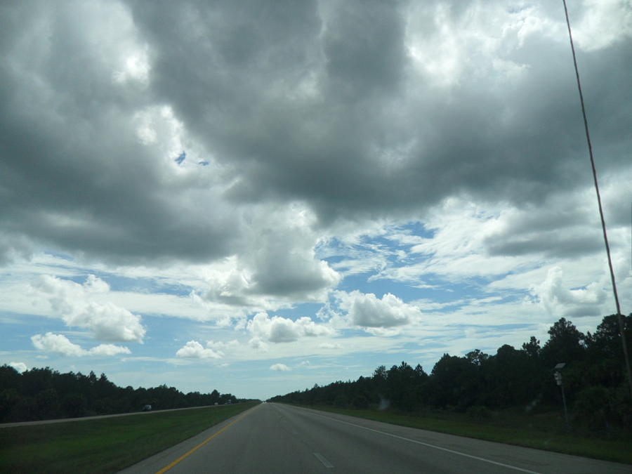 Driving through the Clouds Photograph by Val Oconnor