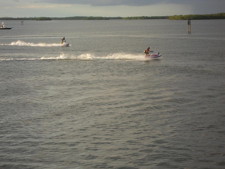 Dueling Jet Skis Photograph by Val Oconnor