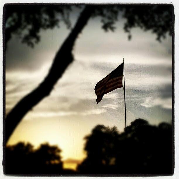 Dusk & Flag Photograph by Hector Torres