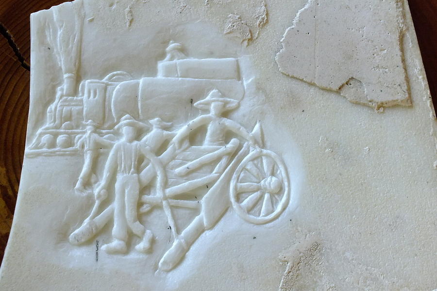 East to West relief on marble  Sculpture by Debbi Saccomanno Chan