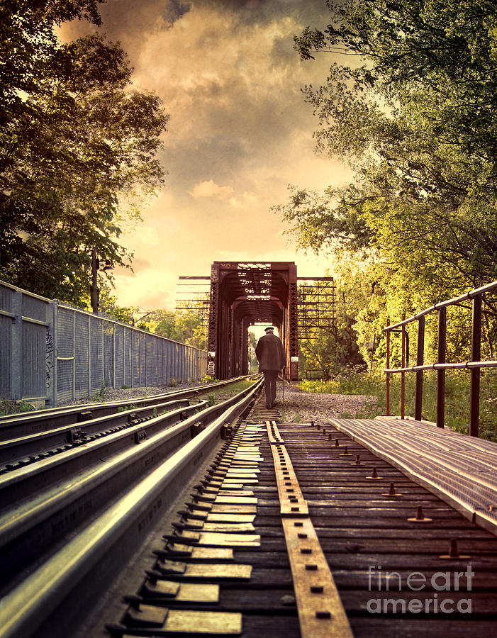 Elderly man walking on train tracks Photograph by Sandra Cunningham