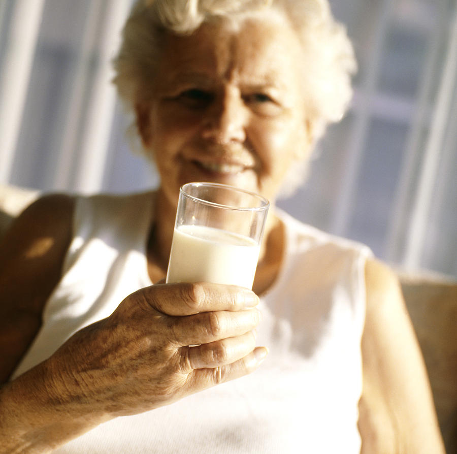 Elderly Woman Drinking Milk Photograph By Cristina Pedrazzini