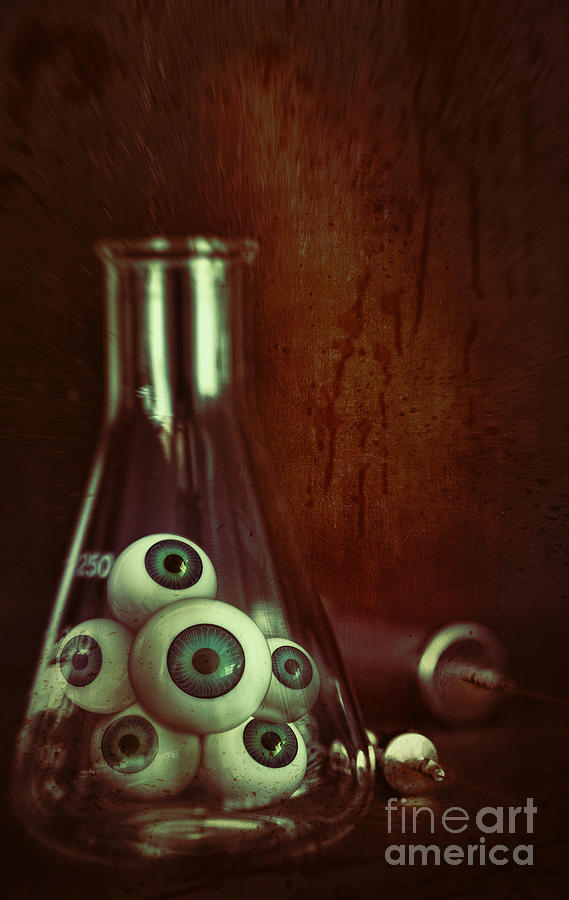 Eyeballs in lab beaker with needles Photograph by Sandra Cunningham