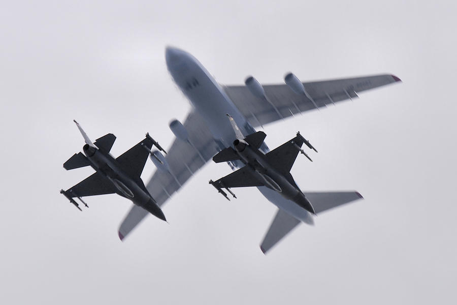 F-16s and Antonov AN-124  Photograph by Tim Beach