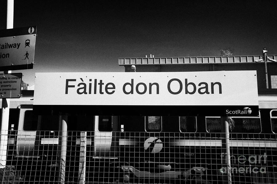 Sign Photograph - Failte Don Oban Welcome To Oban In Scots Gaelic Sign At Oban Train Station Scotland Uk by Joe Fox