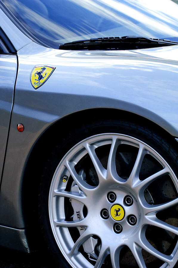 Ferrari Wheel and Emblems Photograph by Jill Reger