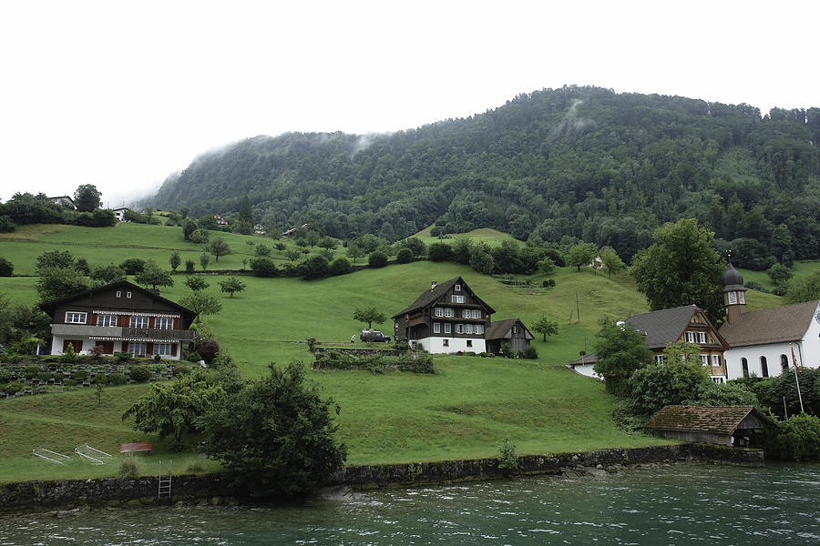 Few houses on a mountain slope on the shore of Lake Lucerne in S Photograph by Ashish Agarwal