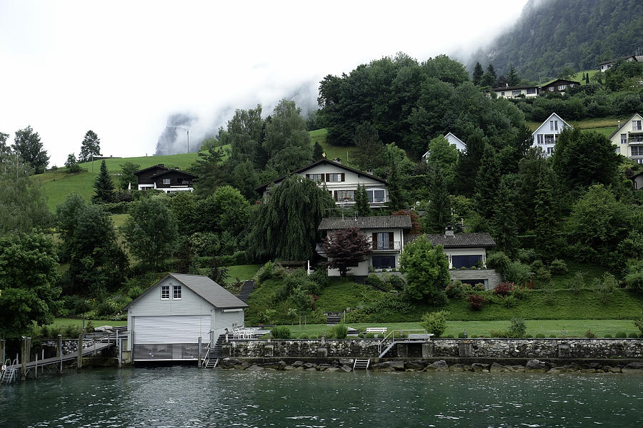 Few houses on the slope of mountain next to Lake Lucerne in Switzerland Photograph by Ashish Agarwal