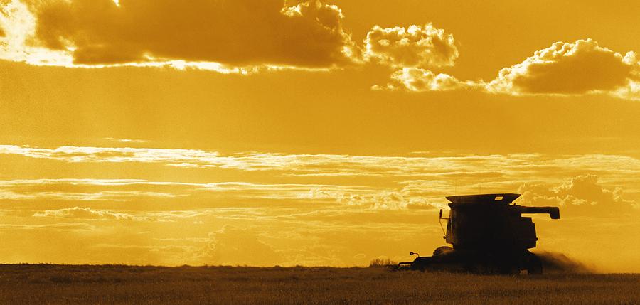 Sunset Photograph - Field With Combine At Sunset by Darren Greenwood