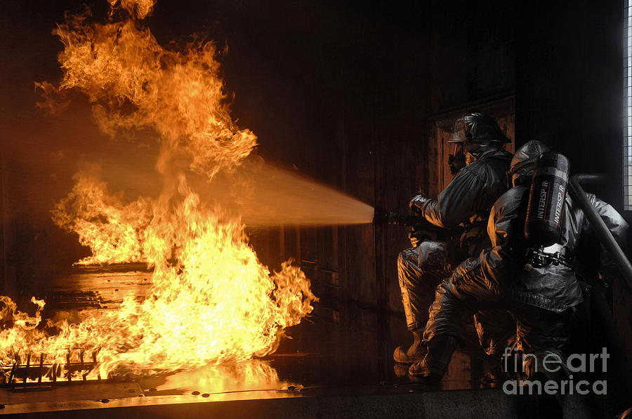 Adults Only Photograph - Firefighters Extinguish A Simulated by Stocktrek Images