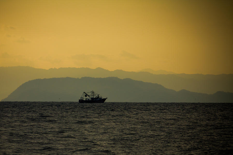 Fishing Boat at Sunset Photograph by Anthony Doudt