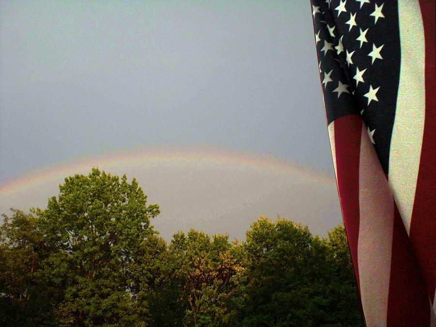 Flag and Rainbow Photograph by Nancy Sisco