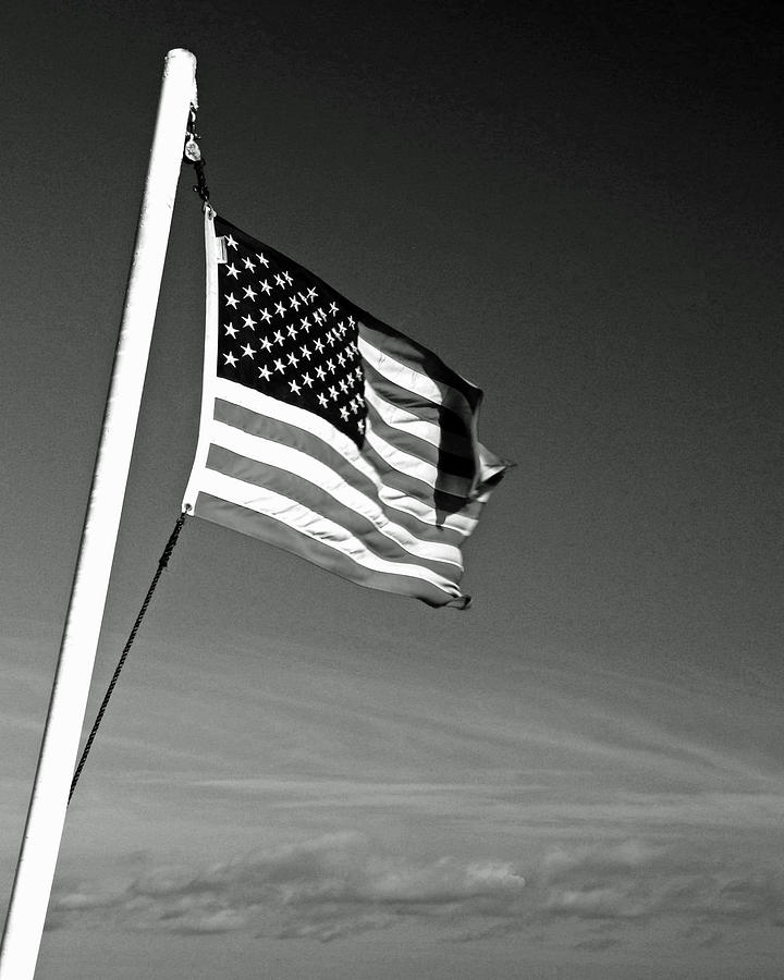 Flag in clouds black and white Photograph by Laura Paton - Fine Art America