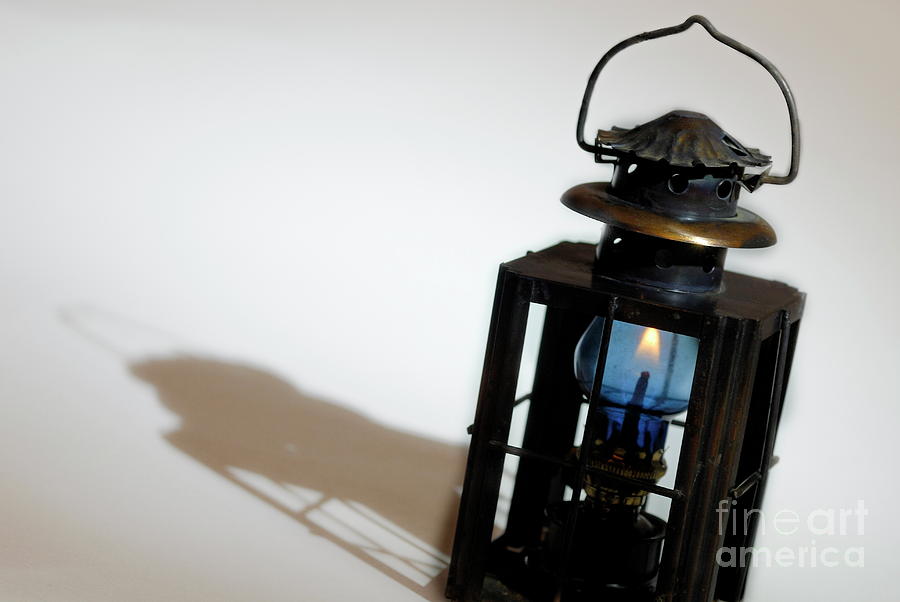 Lantern Still Life Photograph - Flame in lantern with shadow by Sami Sarkis