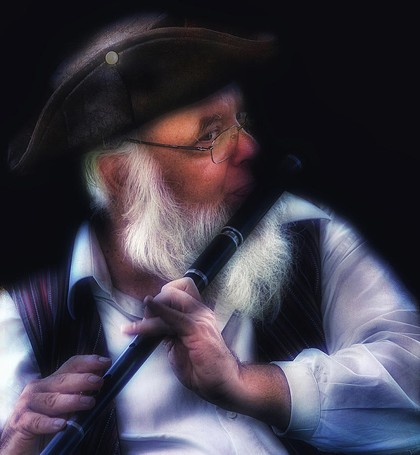 Flute Player Photograph by John Rivera