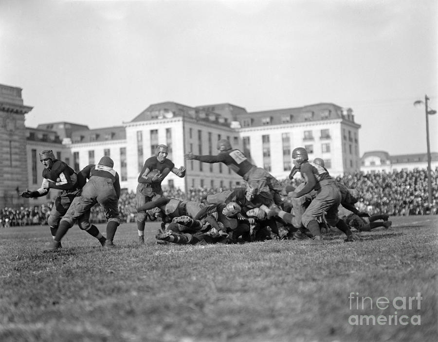 FOOTBALL GAME, c1915 Photograph by Granger