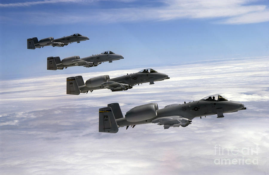 Four A-10 Thunderbolt IIs Fly Photograph by Stocktrek Images