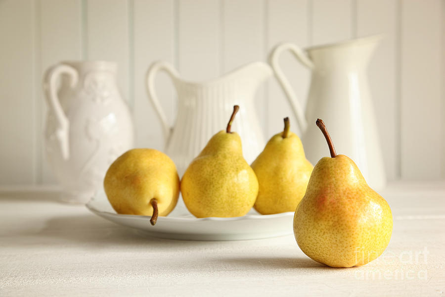 Fresh pears on wooden table Photograph by Sandra Cunningham