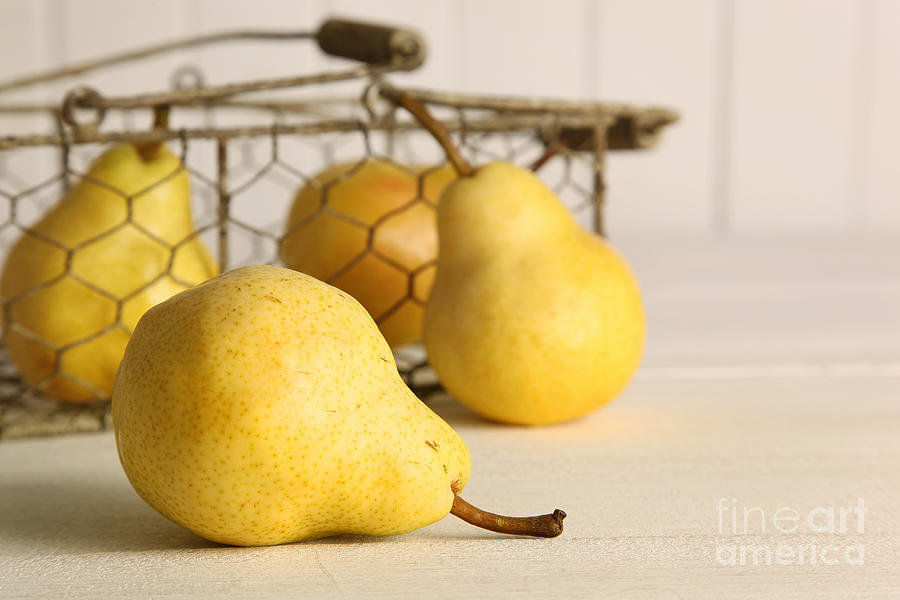 Juice Photograph - Fresh ripe pears in basket on table by Sandra Cunningham