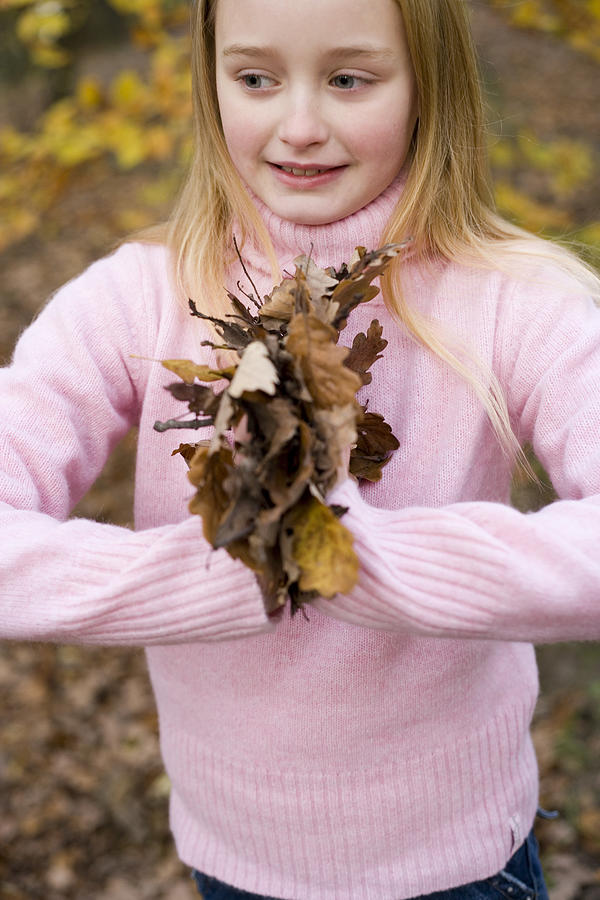 Fall Photograph - Girl Holding Autumn Leaves by Ian Boddy