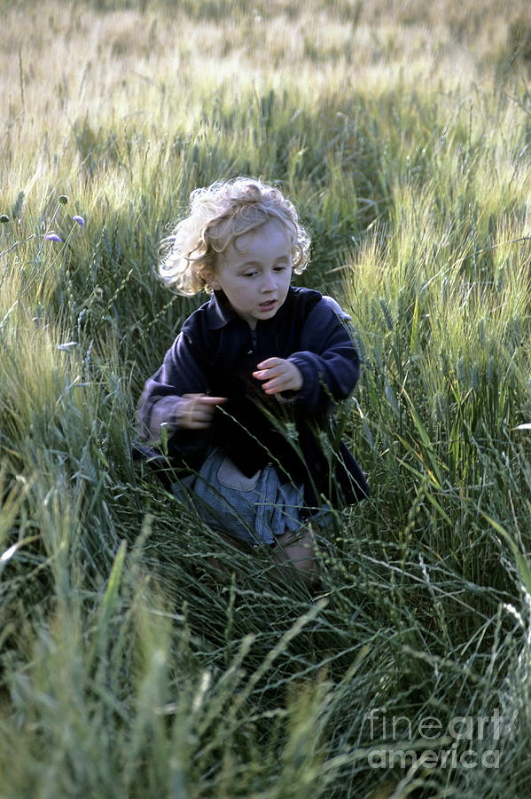 Girl running in wheat field Photograph by Sami Sarkis